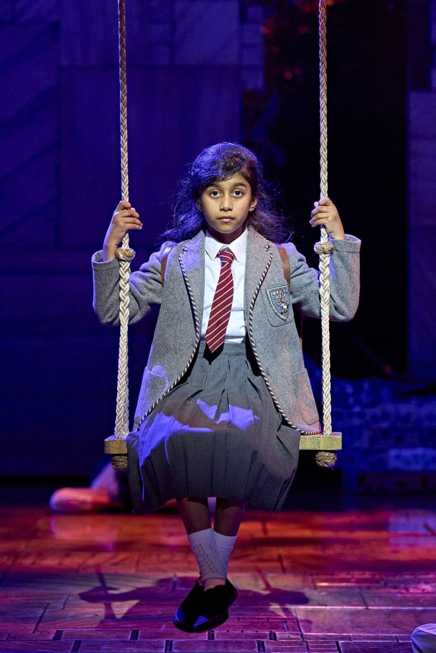 Cast members in a production scene from Matilda