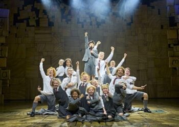 Matilda musical cast performing together on stage