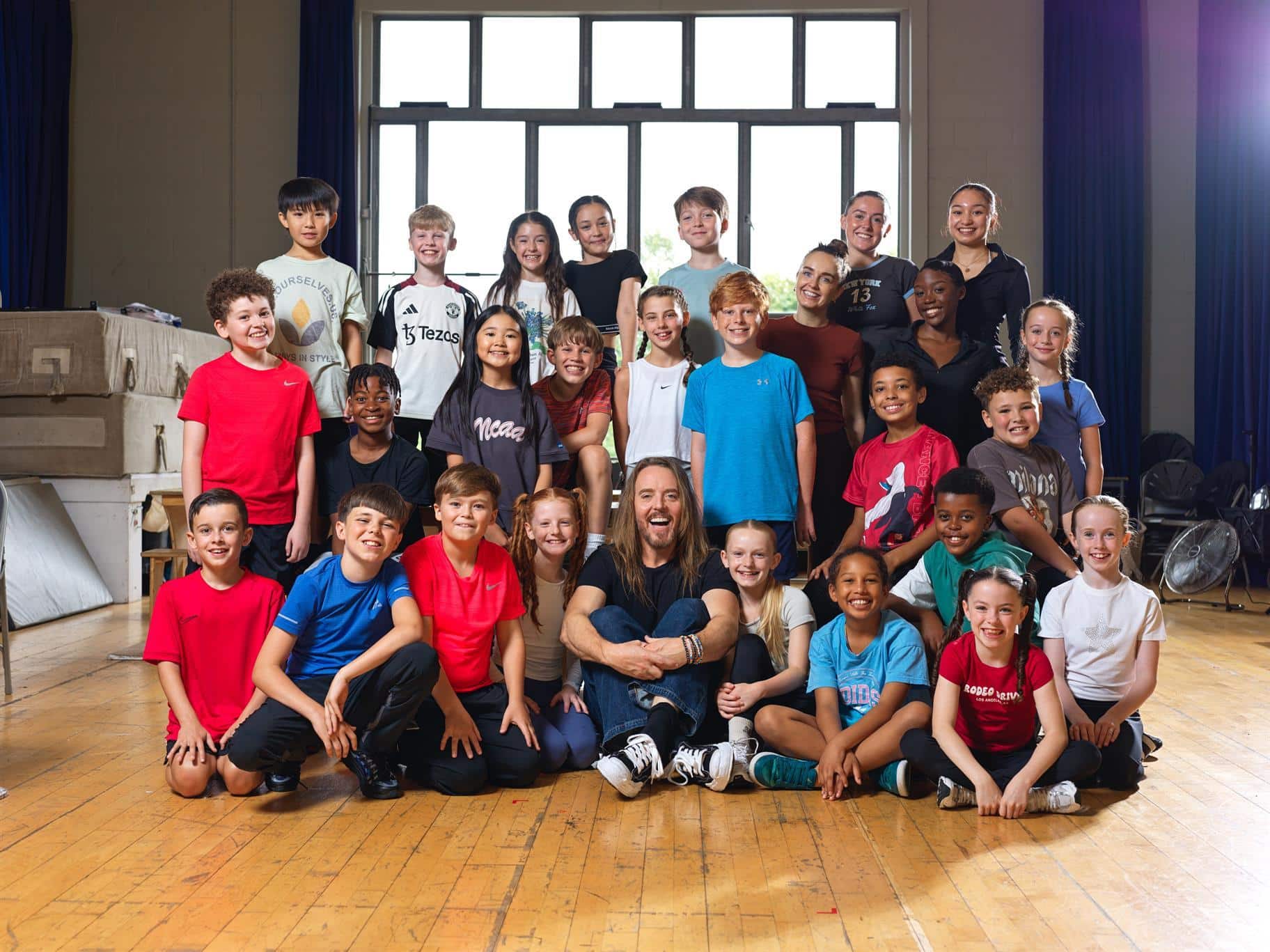 Tim Minchin with the young touring cast of Matilda The Musical