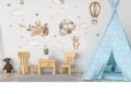 Teddy bear and hot air balloon wall sticker arranged on a nursery wall