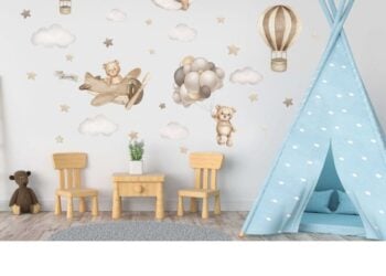 Teddy bear and hot air balloon wall sticker arranged on a nursery wall