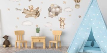 Teddy bear and hot air balloon wall sticker arranged on a nursery wall