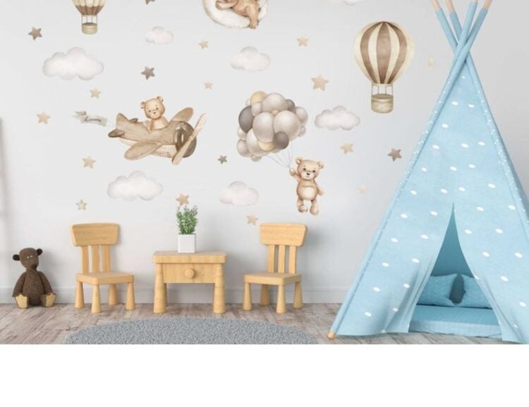 Teddy bear and hot air balloon wall sticker arranged on a nursery wall