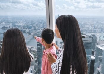 Family viewing New York from One World Observatory