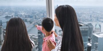 Family viewing New York from One World Observatory