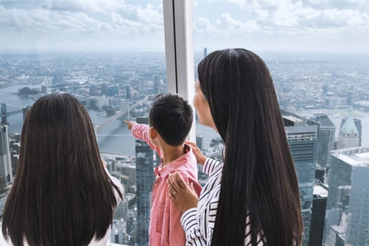 Family viewing New York from One World Observatory