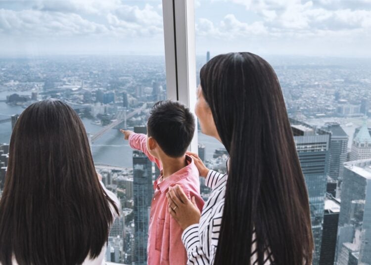 Family viewing New York from One World Observatory