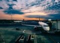 Aircraft beside an airport terminal