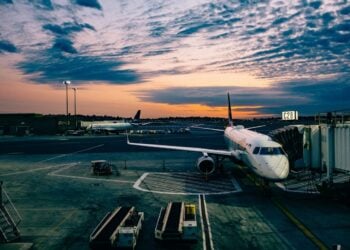Aircraft beside an airport terminal