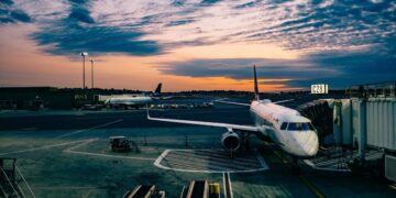 Aircraft beside an airport terminal