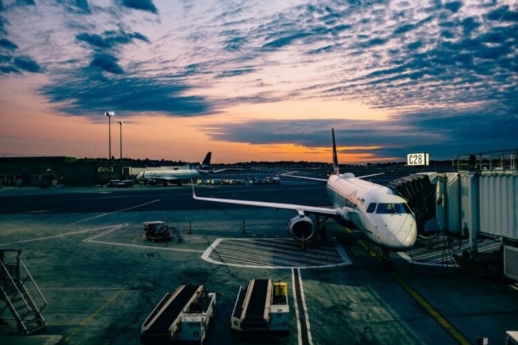 Aircraft beside an airport terminal