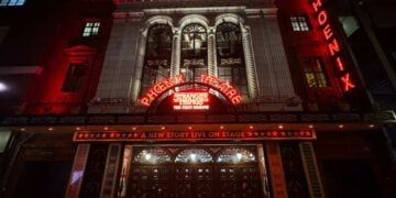 The Phoenix Theatre exterior illuminated at night for Stranger Things: The First Shadow