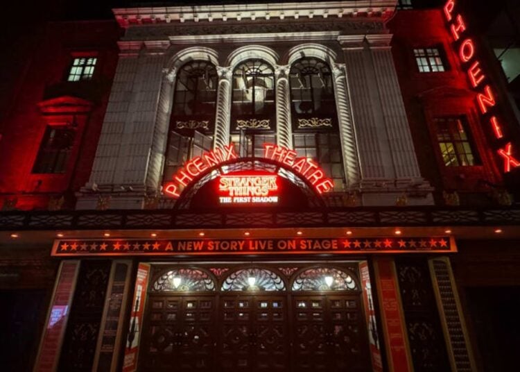 The Phoenix Theatre exterior illuminated at night for Stranger Things: The First Shadow