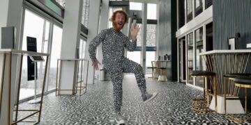 A visitor in a patterned outfit at The View from The Shard