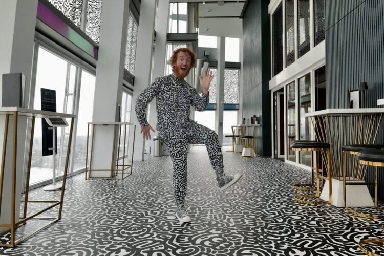 A visitor in a patterned outfit at The View from The Shard