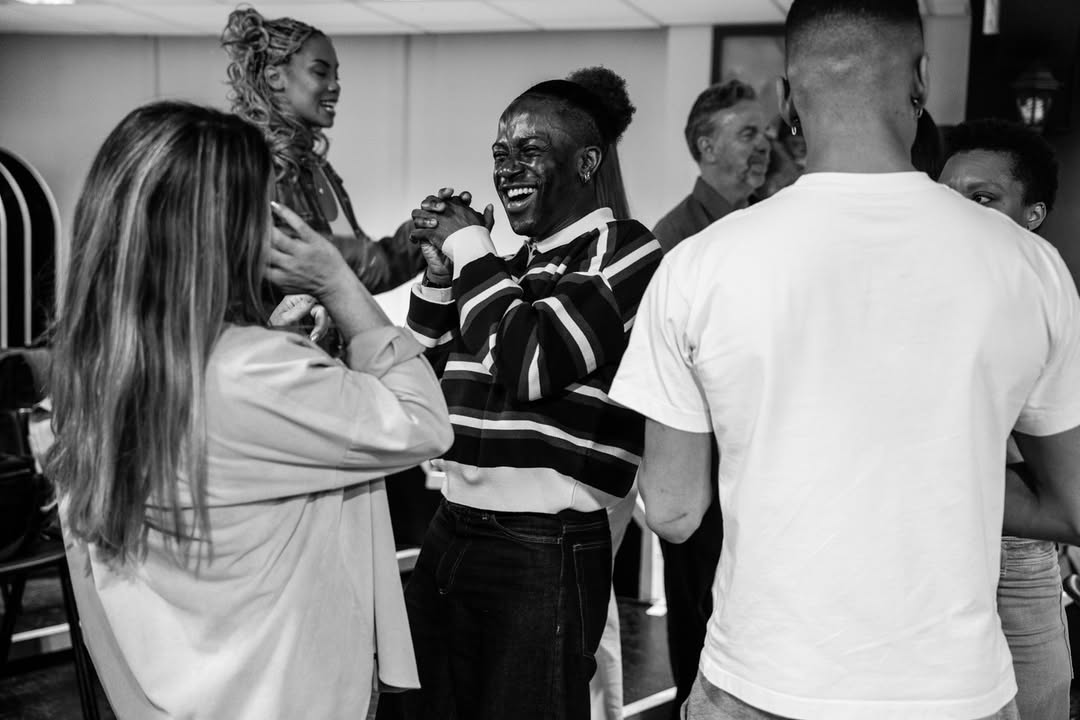 Cast members laughing backstage at Sinatra the Musical