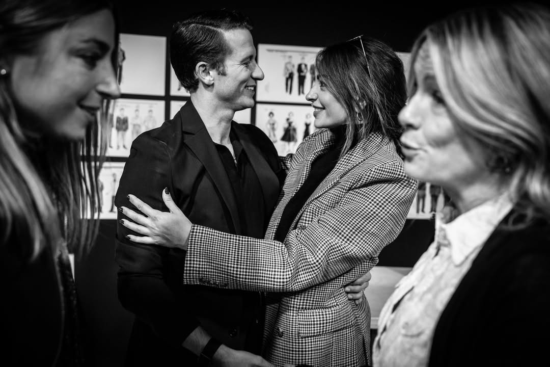 A performer greeting a woman backstage at Sinatra the Musical