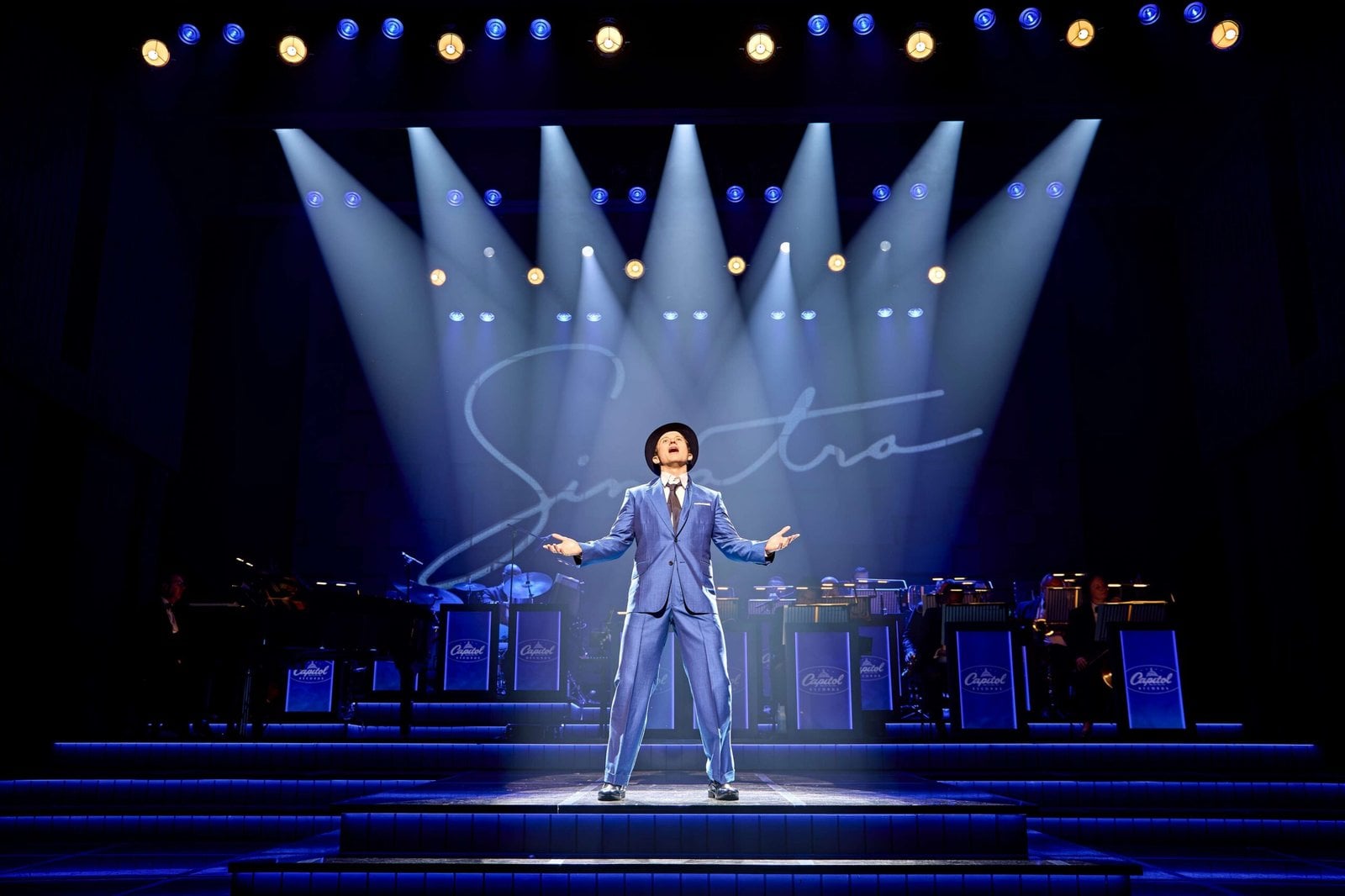 A solo singer performing on the Sinatra the Musical stage
